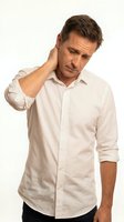 Middle-aged Caucasian man wearing cream button-up shirt experiencing neck pain or stiffness, touching his neck with concerned expression for healthcare and wellness concepts.
