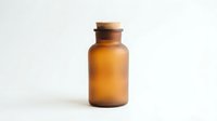 Amber glass apothecary bottle with cork stopper isolated on white background for pharmaceutical and cosmetic packaging design.