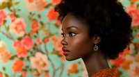 Young African woman with natural afro hairstyle and bright makeup in orange dress against floral background, side profile portrait showing elegant beauty.