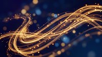 Abstract golden light trails flowing in smooth curves with glowing particles and bokeh effects on dark blue background for technology and digital concepts.