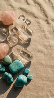 Collection of healing crystals and gemstones on natural burlap fabric with soft shadows for spiritual wellness and meditation practices.