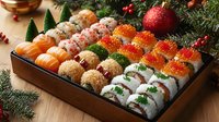 Festive sushi platter with salmon, red caviar and California rolls decorated with Christmas ornaments and pine branches on wooden background. Perfect for holiday menu.