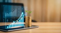 Digital tablet displaying financial growth charts with coin stack and green plant sprout symbolizing sustainable investment and economic prosperity.