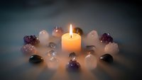 Healing crystals arranged in circle around glowing candle for meditation, spiritual wellness and energy cleansing rituals in peaceful atmosphere.