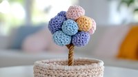 Handcrafted crochet flower in pastel colors of blue, purple, pink, and yellow arranged in pot, made with soft yarn against blurred interior background.