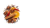Christmas spices arrangement with cinnamon sticks, star anise, dried orange slices and cloves on white background for holiday cooking and baking recipes.