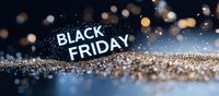 Glowing Black Friday text on dark background with scattered golden glitter and bokeh lights creating festive shopping season atmosphere.