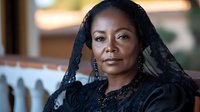 African American mature woman wearing black lace mantilla and elegant dress with ornate jewelry, expressing dignity and grace in traditional formal attire.