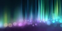 Vibrant aurora-like light streaks in blue, green and purple colors with glowing bokeh effects on dark background, creating magical atmospheric display.