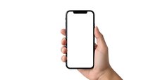 Hand holding modern smartphone with blank white screen isolated on white background for mockup and app presentation purposes.