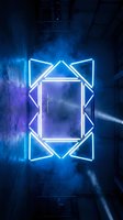 Neon geometric frame glowing blue and purple in dark industrial warehouse with smoke and atmospheric lighting, suitable for nightlife, technology, and modern design projects.