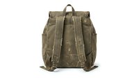 Vintage olive green canvas backpack with leather straps and buckles isolated on white background for outdoor adventure and travel designs.
