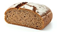Artisan dark rye bread loaf with dense crumb texture isolated on white background for bakery menu design and culinary projects.