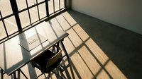 Sunlit empty classroom desk with hello sign, dramatic window shadow grid on floor, minimalist school interior with warm natural light.