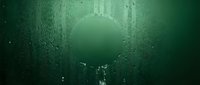 Underwater tunnel with glowing green light at the end, submerged concrete structure covered in algae and moss, mysterious deep water exploration scene.