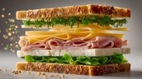 Freshly made club sandwich with ham, cheese, lettuce, tomato, and herbs on toasted bread, showcasing layers of ingredients against gray background.