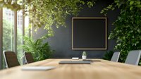 Modern conference room with wooden table, dark wall, golden frame, and lush greenery creating natural atmosphere for business meetings.