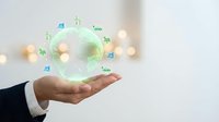 Hand holding glowing green globe with digital icons representing global network, sustainability, and worldwide connectivity for business and technology concepts.