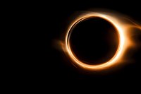Solar eclipse with bright orange corona ring glowing against black space background for astronomy and celestial event concepts.