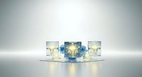 Glasses with clear and blue cocktails containing ice cubes and lemon slices arranged on reflective surface with studio lighting for beverage and hospitality design use.