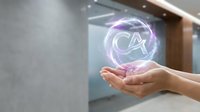 Hand holding glowing purple holographic CA certification symbol in modern office environment, representing professional credentials and digital technology advancement.
