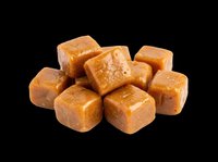 Caramel candy cubes isolated on transparent background, ready for design use on t-shirts, stickers, clipart, print-on-demand products and sublimation projects.