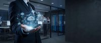 Businessman holding holographic cloud computing network icons in modern data center server room for digital transformation and technology solutions.