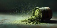Green superfood powder spilling from container with particles floating in air creating dynamic health supplement scene for wellness marketing.