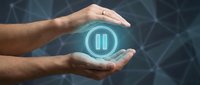 Male hands protecting glowing pause button icon on dark digital network background. Business control and workflow management concept for presentations.