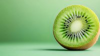 Fresh ripe kiwi fruit half showing detailed pulp texture and seeds on soft green background with copy space, macro food photography.