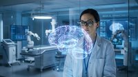 Female scientist examining holographic brain projection in modern medical laboratory with advanced technology equipment.