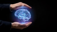 Businessman hands protecting glowing digital brain hologram on black background representing mental health care, artificial intelligence and neurological protection.