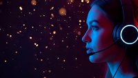 Professional female gamer with headset in neon lighting against bokeh background for esports and gaming content.