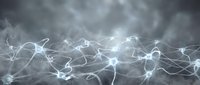Glowing neural network with interconnected nodes and synapses on a dark misty background, representing brain activity and artificial intelligence.