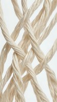 Intertwined natural fiber cords in cream and beige tones create an abstract woven pattern against a clean white background, suitable for textile and design projects.