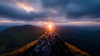 Dramatic sunset over mountain peak with glowing cross silhouette against stormy clouds, spiritual landscape photography capturing divine light and nature's majesty.