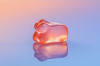 Translucent pink gummy bunny candy with glossy reflection on a pastel gradient purple and orange background for Easter or confectionery design.