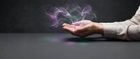Businessperson's hand releasing glowing purple energy waves and magical light particles against dark background, symbolizing power, innovation, and digital transformation.
