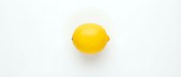 Fresh yellow lemon isolated on white background for culinary design projects and healthy food concepts.