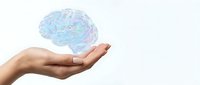 Human hand holding holographic brain model representing neuroscience, mental health, artificial intelligence and cognitive science concepts.