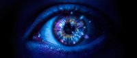 Blue cosmic eye with galaxy patterns and starlight reflections in iris creating mystical vision concept for fantasy and science fiction designs.