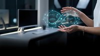 Businesswoman holding glowing infinity loop hologram with cognitive adaptation and continuous loop labels in modern office.