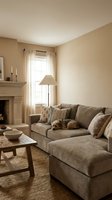 Cozy beige living room interior with sectional sofa, fireplace, and warm neutral tones for home decor and residential design projects.