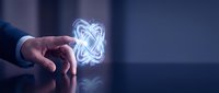 Businessman holding glowing neon infinity symbol in hand against dark background, representing endless possibilities, growth, and continuous innovation for business concepts.