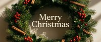 Festive Christmas wreath with red berries, cinnamon sticks, and green fir branches, decorated with Merry Christmas text on warm background.