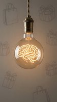 Vintage Edison bulb with glowing brain filament hanging from brass socket against gift box pattern background symbolizing creative ideas and innovation.