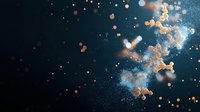 Artistic composition of floating orange and white particles with bokeh effect against dark background, creating ethereal cosmic atmosphere. Suitable for abstract designs.