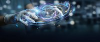 Businessman hand holding futuristic holographic digital sphere with glowing particles and network connections for technology innovation concepts.