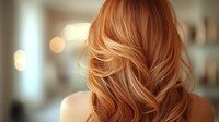 Strawberry blonde woman with wavy hair from behind, soft bokeh background creates dreamy atmosphere for beauty salon advertising.