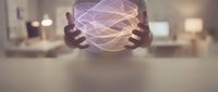 Hands holding glowing purple holographic sphere with flowing light trails in modern office environment for technology and innovation concepts.